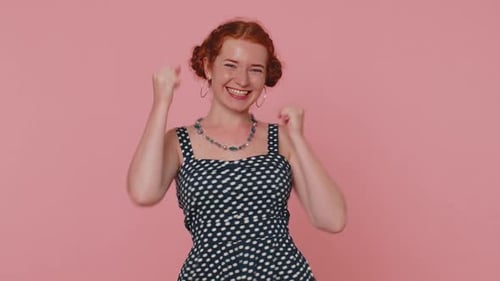 Woman Celebrates Success With Joyful Gestures