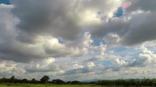 timelapse of landscape with high wind bring cumulus clouds so fastly
