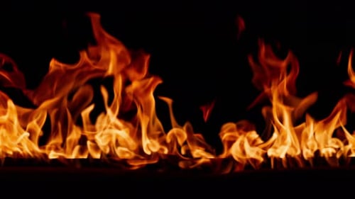 Beautiful Dancing Fire Burning Flame Tongues of Orange Flame Bright Burning Flames on a Black
