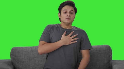 Indian man having an Asthma attack Green screen