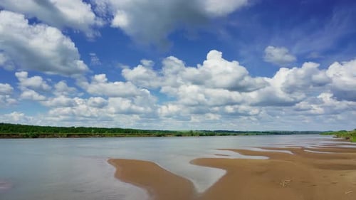 Clouds over river landscape