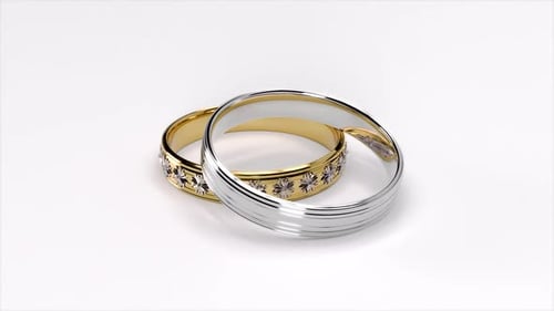Anillos de boda. Anillo de oro y plata. Animación giratoria. Resolución HD de 1920 x 1080.