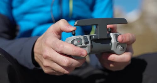 Close Up View Of holding remote control of for drone.