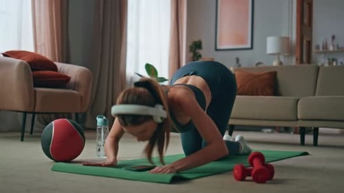 Young Woman Doing Yoga at Home