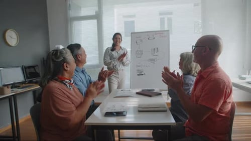 Tech Presentation Receives Applause in Modern Office