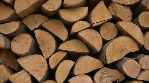 Close-Up View of Stacked Firewood Logs