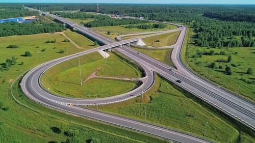 Transport Interchange on the Highway Aerial of Cars Drive Along the Highway Outside the City