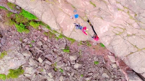 Rock Climbers On Steep Rocky Cliff, Aerial Drone Shot 4k