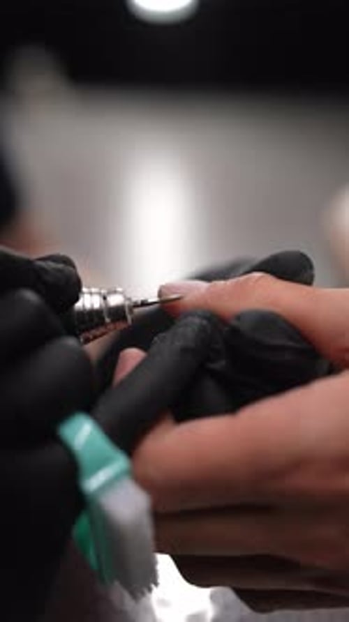 Nail Work with an Electric File Close-Up