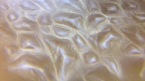 Abstract Light Shimmers on a Pale Surface