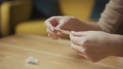 Woman Applies Adhesive Bandage to Hand Close Up