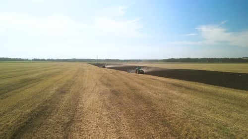 Tractors plowing the field in Ukraine