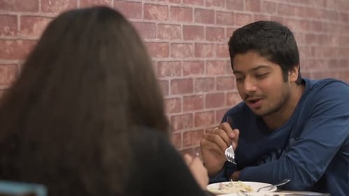A girl and a boy are eating at a restaurant on their romantic date, love, couple goals, romantic dat