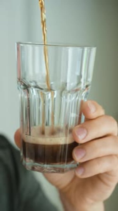 Sugary drink poured into glass