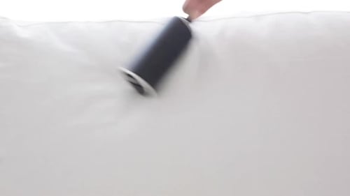 Lint Roller Used on a White Sofa