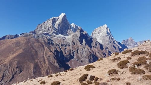 Aerial View of Mount Everest Dominating Nepalese Landscape Piercing Sky with Snow Laden Summit