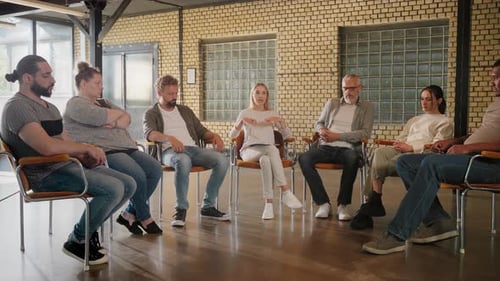 Adults Sitting in Circle During Group Therapy Session