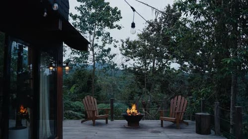 Cozy Wooden Cabin Terrace with Burning Fire Pit