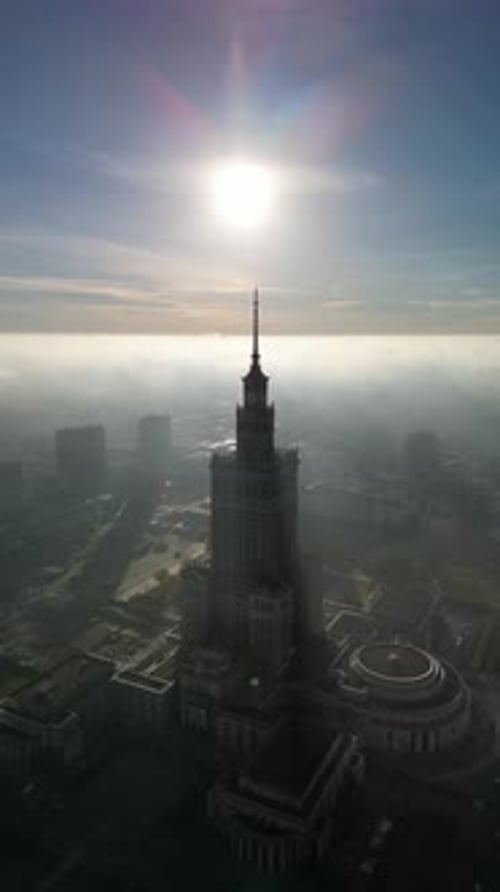 Drone footage of Warsaw city center against a beautiful winter sunset