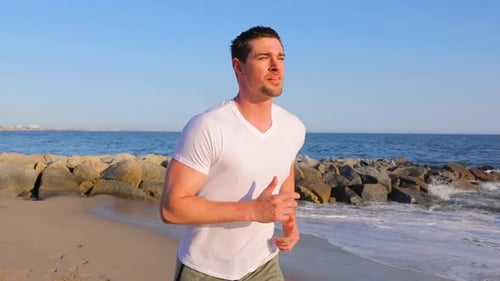Athletic Man Exercising At The Beach