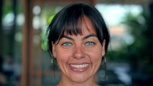 Attractive Woman Smiles in Close Up Portrait