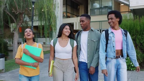 Four Young Latin American Student Friends Leaving Campus College After Classes