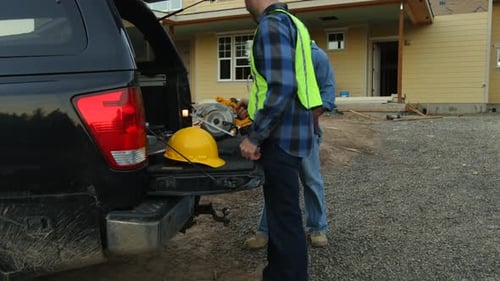 Construction Workers at a Suburban Construction Site
