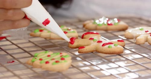 Festive Christmas cookies cooling on rack, decorated with colorful icing, copy space