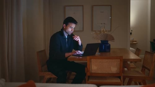 Manager Analyzing Data Laptop at Evening Home Office Room Taking Documents