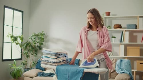 Woman Ironing Laundry at Home with a Smile