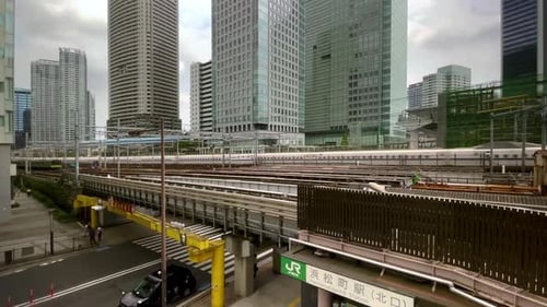 Bullet Trains Pass Over Tokyo Street