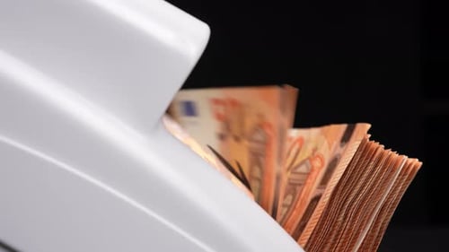 Close Up of Money Counting Machine Counting Euros
