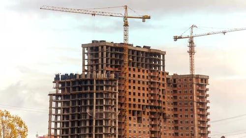 Construction Cranes Building a High-Rise in the City