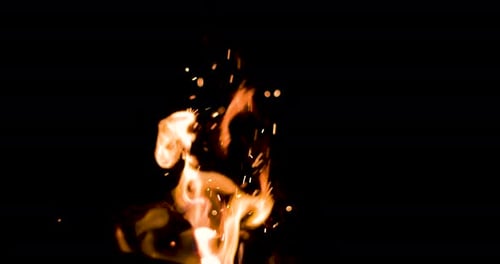 Pretty sparks flying out of a fire, 4k slow motion 100fps