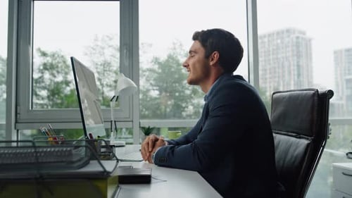 Handsome Freelancer Talking Online at Remote Workplace. Office Manager Calling Greeting Partner