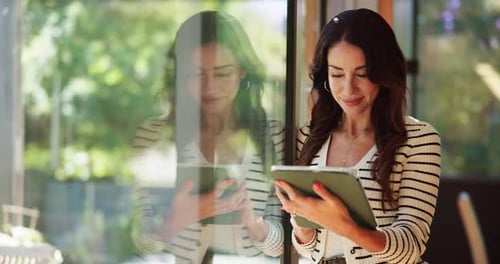 Woman Using Tablet Inside by Window