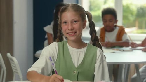 Caucasian Girl Portrait Happy Schoolgirl Pupil Student Learner in Classroom Primary School Education