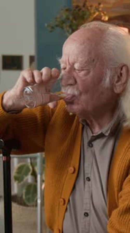 Senior Man Drinking Water Vertical