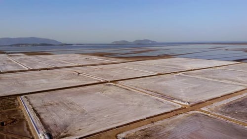 View of a Salt Flat Factory Besides the Sea Drone Shot of Salt Extraction