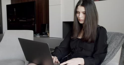 Young Adult Business Woman Typing on Laptop Computer Working in Internet