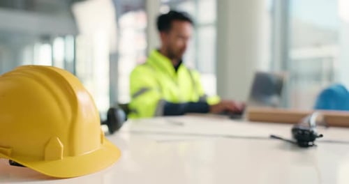 Man, helmet and architect with laptop at office for construction planning or building renovation
