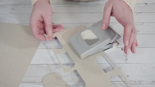 Woman Crafts Gift Tags with Tag Paper Punch