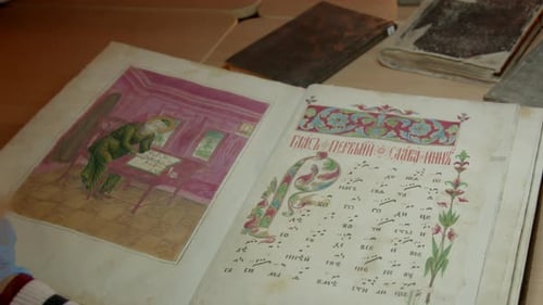 Turning Pages of Antique Illustrated Manuscript Book