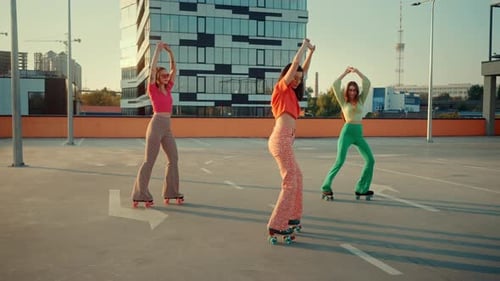 Stylish Young Women Roller Skating in Bright Sunshine