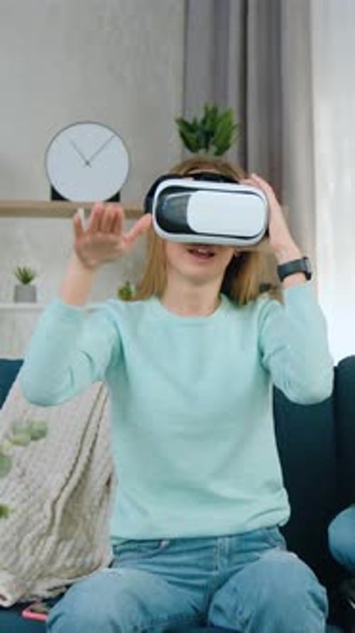 Woman Using VR Headset with Child on Laptop