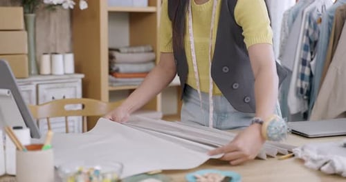 Young Woman Working with Fabric in Bright Studio
