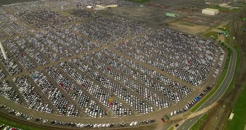 Aerial Top View of New Cars Parking for Sale Stock Lot Row Dealer Inventory Import and Export