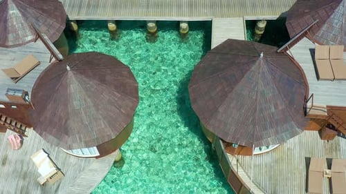 Luxury Overwater Villas with Coconut Palm Trees Blue Lagoon White Sandy Beach at Bora Bora Island