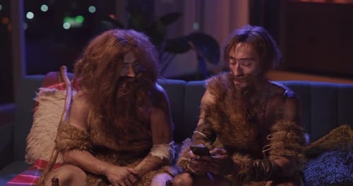 Couple of Funny Bearded Animal Furry Savages From Stone Age Traveling in Time Breaking to House