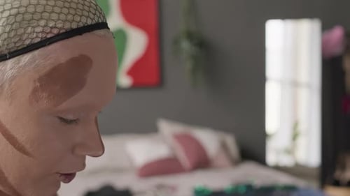 Queer Man Applying Sculptor on Face while Doing Makeup